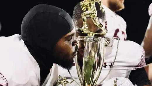 Texas Southern Football players kissing Labor Day Classic Trophy